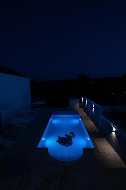 Villa Zulfikar pool illuminated at night