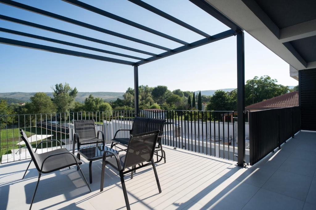 Villa Zulfikar outdoor terrace with pergola seating area